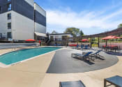 Thumbnail 57 of 73 - our apartments have a large pool and lounge chairs at Troy Place Apartments - Troy, MI, Troy, 48084