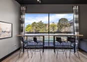 Thumbnail 62 of 73 - a rendering of a balcony with a table and chairs at Troy Place Apartments - Troy, MI, Troy, Michigan