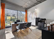 Thumbnail 68 of 73 - a home office with a desk and a large window at Troy Place Apartments - Troy, MI, Troy, Michigan