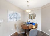 Thumbnail 41 of 73 - a dining room with a table and chairs at Troy Place Apartments - Troy, MI, Troy