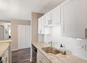 Thumbnail 19 of 73 - a kitchen with white cabinets and a sink at Troy Place Apartments - Troy, MI, Michigan