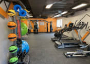 Thumbnail 52 of 73 - a gym with a lot of exercise equipment in it at Troy Place Apartments - Troy, MI, Troy, Michigan