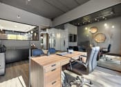 Thumbnail 69 of 73 - a modern office with a desk and chairs at Troy Place Apartments - Troy, MI, Troy, 48084