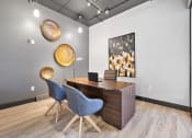 Thumbnail 71 of 73 - a conference room with a wooden desk and chairs at Troy Place Apartments - Troy, MI, Troy, Michigan