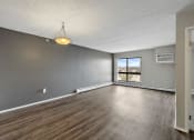 Thumbnail 33 of 73 - wood floors and a window at Troy Place Apartments - Troy, MI, Troy