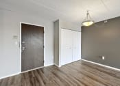 Thumbnail 37 of 73 - Unfurnished living room with a door to a closet at Troy Place Apartments - Troy, MI, Troy, Michigan
