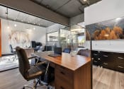Thumbnail 66 of 73 - a home office with a desk and a large window at Troy Place Apartments - Troy, MI, Michigan