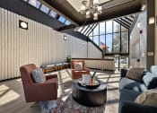 Thumbnail 65 of 73 - a living room with couches and chairs and a table at Troy Place Apartments - Troy, MI, Troy, Michigan