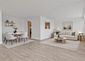 Thumbnail 15 of 31 - A modern living room with a dining table and a couch.