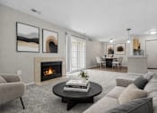 Thumbnail 26 of 87 - Living room with fireplace and neutral furnishings at Village Club of Farmington Hills Apartments, Farmington Hills, 48331