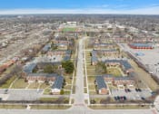 Thumbnail 28 of 32 - an aerial view of a neighborhood with cars parked in a parking lot