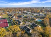 Thumbnail 32 of 34 - an aerial view of a neighborhood with houses and trees
