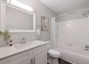 Thumbnail 16 of 34 - a white bathroom with a sink toilet and tub