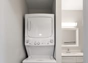 Thumbnail 19 of 34 - an empty laundry room with a washer and dryer