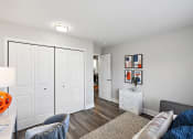 Thumbnail 23 of 34 - a living room with white closets and a couch