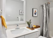 Thumbnail 17 of 34 - a bathroom with a sink toilet and a mirror
