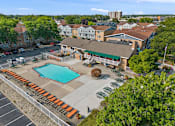 Thumbnail 22 of 25 - A pool surrounded by bleachers in a residential area.