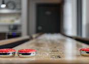 Thumbnail 64 of 116 - A table with two red buttons on it and a blurry background at The Waverly on the Lake - Belleville, MI Apartment , Belleville, 48111