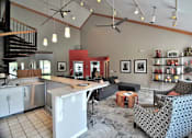Thumbnail 17 of 26 - A kitchen with a dining table and chairs.