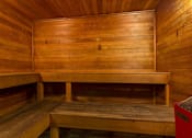 Thumbnail 81 of 87 - Wooden sauna with tiered bench seating at Village Club of Farmington Hills Apartments, Farmington Hills, Michigan