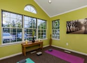 Thumbnail 75 of 87 - Yoga studio with natural light and wood accents at Village Club of Farmington Hills Apartments, Farmington Hills