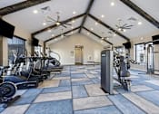 Thumbnail 25 of 39 - A spacious gym with a variety of exercise equipment.