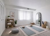 Thumbnail 7 of 31 - A yoga room with a mirror, a potted plant, and a yoga mat.