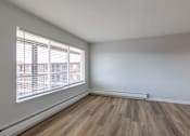 Thumbnail 32 of 44 - A room with a window and wooden flooring. at The Park on 13 Apartments - Royal Oak, MI Apartments, Royal Oak, Michigan