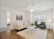 Thumbnail 8 of 18 - a living room with a couch and a coffee table