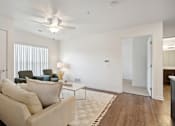 Thumbnail 7 of 18 - an open living room with a couch and a coffee table