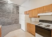 Thumbnail 3 of 21 - A kitchen with a white refrigerator and a white stove top oven.