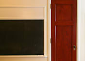 Thumbnail 27 of 27 - A brown door is next to a window.