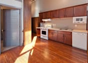 Thumbnail 11 of 25 - Kitchens in Roosevelt School feature microwave, diswasher, range, and refrigerator.