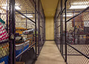 Thumbnail 16 of 17 - A long hallway with a fence on both sides.