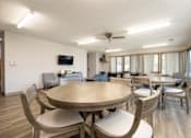 Thumbnail 3 of 20 - A modern dining room with a large table and chairs.