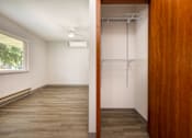 Thumbnail 18 of 20 - A room with a sliding door and a window.