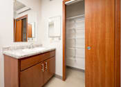 Thumbnail 14 of 20 - A bathroom with a sink, mirror, and medicine cabinet.