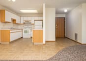 Thumbnail 3 of 14 - A kitchen with white appliances and wooden cabinets.