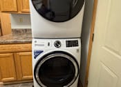 Thumbnail 11 of 11 - Two white ovens are installed in a kitchen.