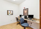 Thumbnail 4 of 17 - A room with a desk and a chair.
