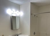 Thumbnail 13 of 13 - A bathroom with a sink, toilet, and bathtub.