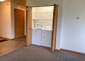 Thumbnail 13 of 15 - A white cabinet with a drawer is in a room with a brown carpet.