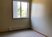 Thumbnail 9 of 13 - A window with blinds is on a wall next to a heater.