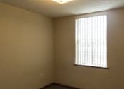 Thumbnail 13 of 17 - A room with a window on the right side.