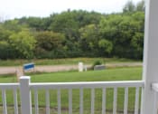 Thumbnail 12 of 12 - A white railing with a sign on top of it.