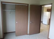 Thumbnail 7 of 12 - Two brown doors in a room.