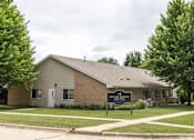 Thumbnail 1 of 6 - A house with a sign in front that says "Welcome to Maple Shade".