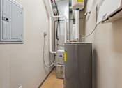 Thumbnail 19 of 30 - A metal stainless steel refrigerator with a yellow tag on it.
