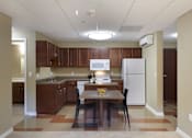 Thumbnail 13 of 28 - a kitchen with wooden cabinets and a white refrigerator