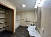Thumbnail 9 of 10 - a small bathroom with a toilet sink and bathtub